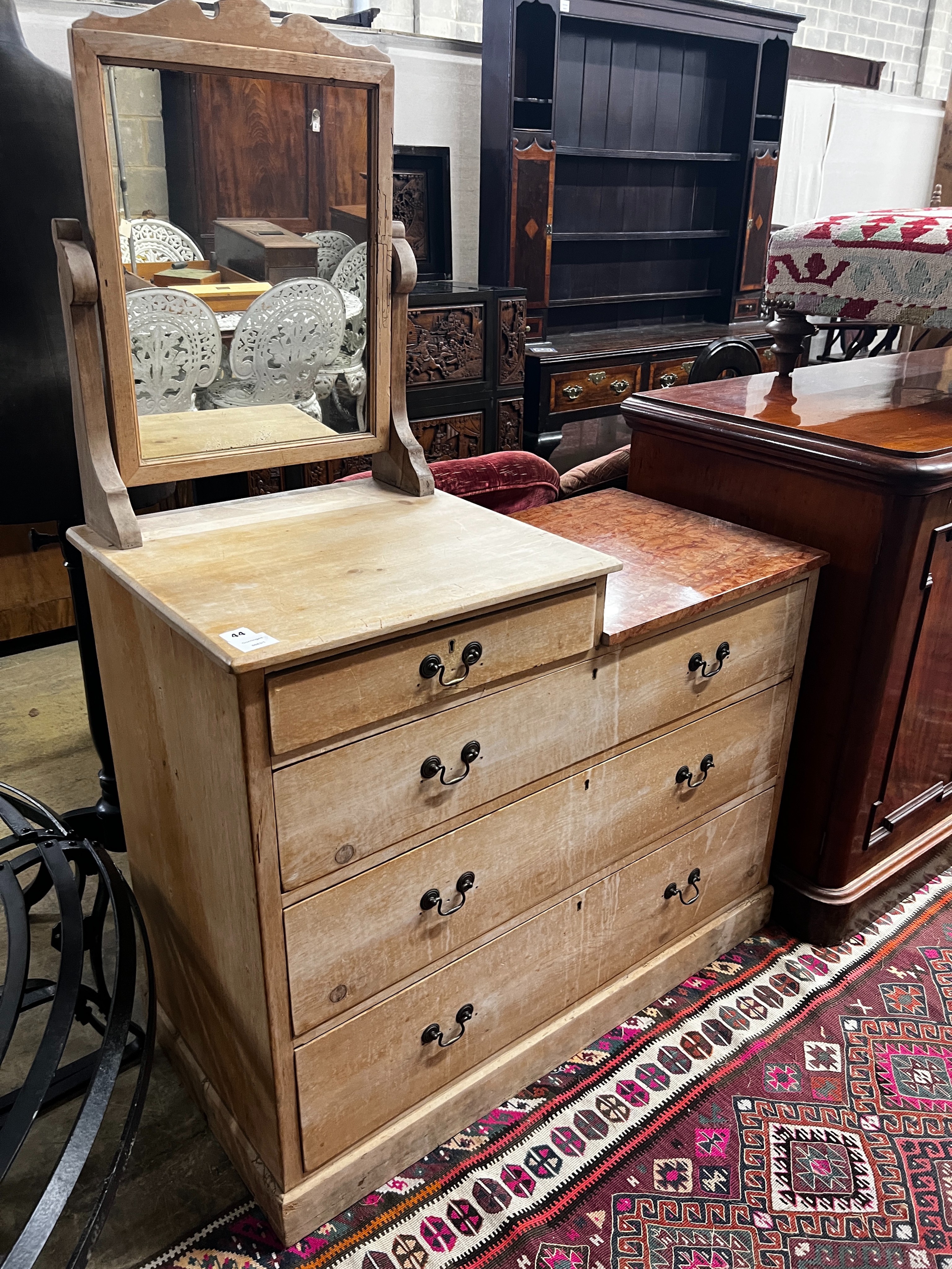 A late Victorian part marble topped four drawer pine dressing chest, width 102cm, depth 48cm, height 146cm